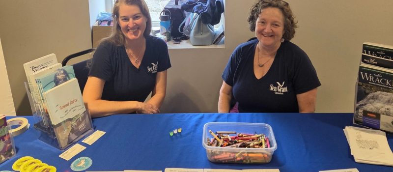 Erica Casper, left, and Syma Ebbin welcomed many visitors at the CT Sea Grant table at the Thames River Heritage Park Partner Fair at Fort Trumbull State Park in New London on May 9.