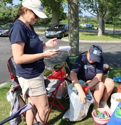 Erica Casper of CT Sea Grant, left, and Maggie Renner of Save the Sound sorted out the recyclables and tallied each piece of trash on a date sheet.