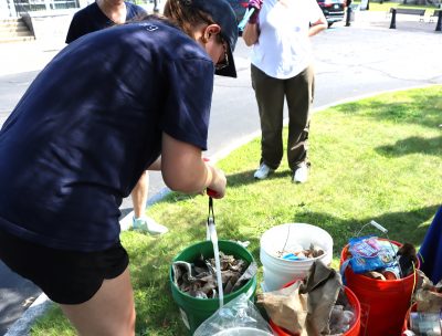 Maggie Renner of Save the Sound weighed each bucket before sorting the trash inside.