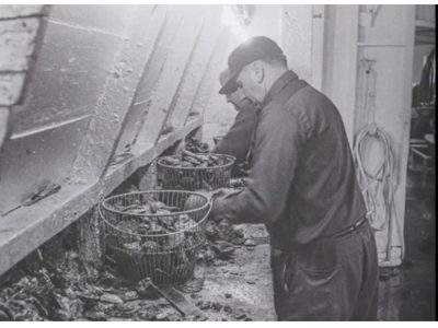 Historical photo of oyster shuckers from shellfish history video