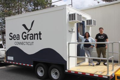 Anoushka Concepcion, left, associate extension educator/seaweed aquaculture, and Clayton McGoldrick, lab technician, show the new mobile seaweed lab that arrived at the UConn Avery Point campus on April 29.