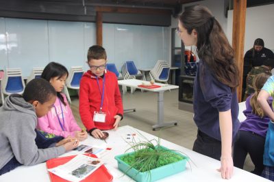 Lisa Wu, educator at The Maritime Aquarium at Norwalk, asks students in the "Life Between the Tides" activity about hermit crabs and salt marshes in an activity during the Long Island Sound School Network Symposium on March. 14.